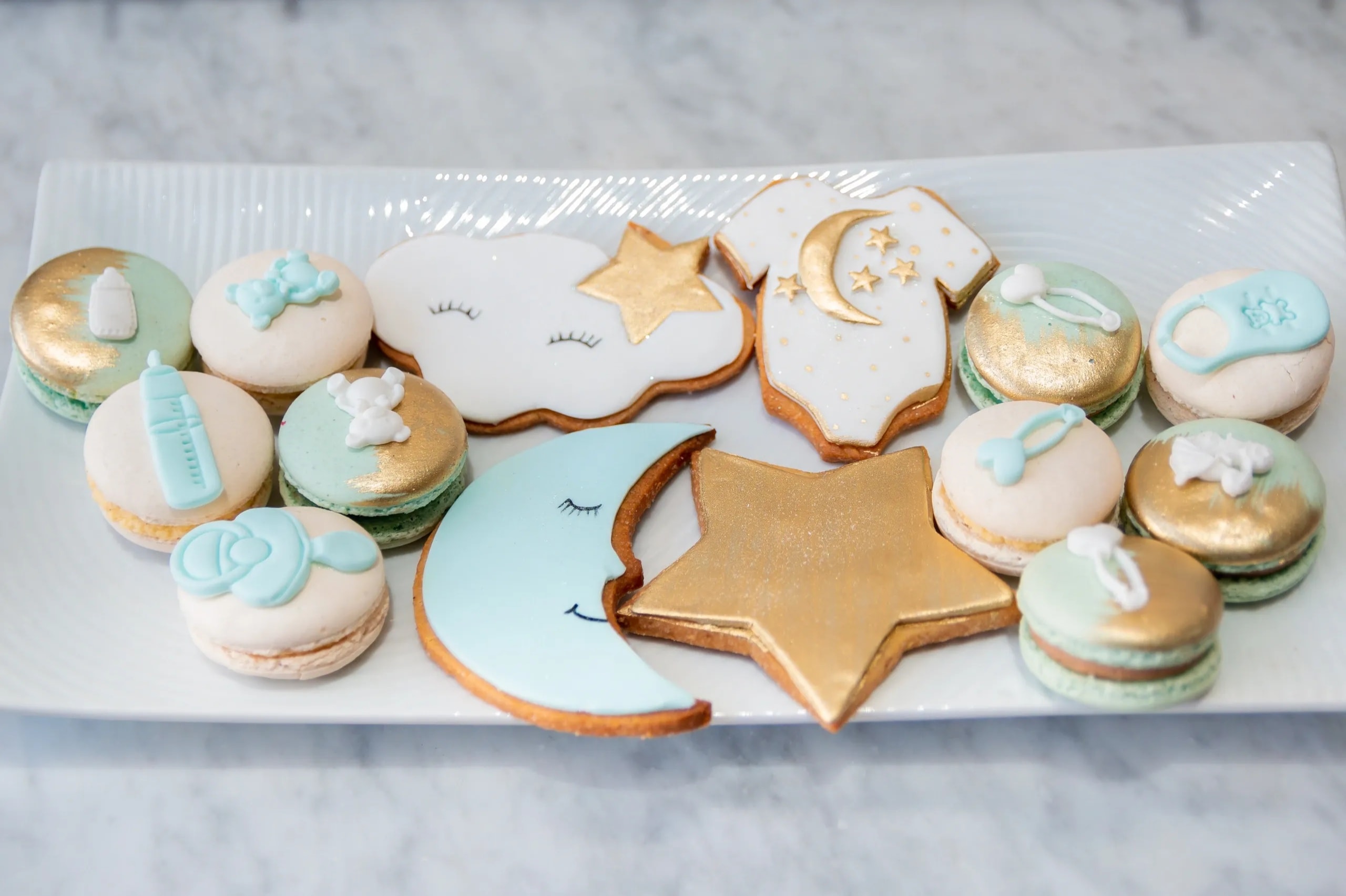 Soft pastel newborn baby shower cookie display
