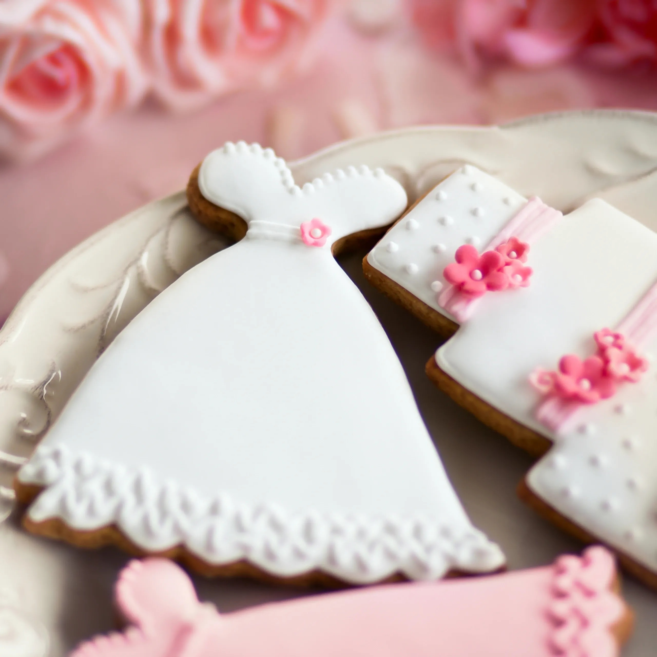 Pastel pink floral bridal shower decorated sugar cookies